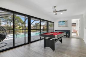 Tropical Tranquility! Luxury pool home with lakefront view just minutes from the beach!